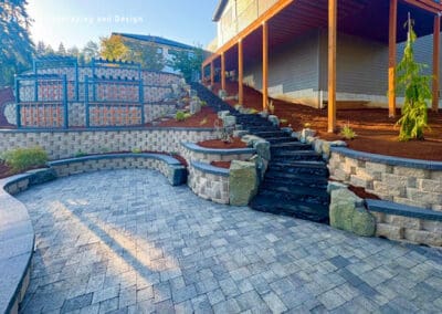 Stone patio with steps to house.