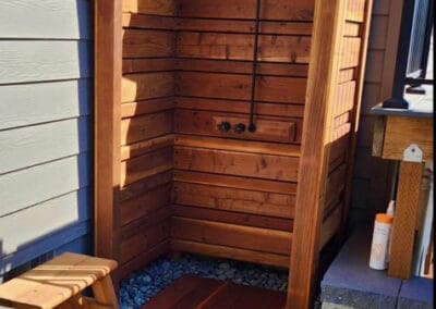 Outside shower build from cedar wood by the house.